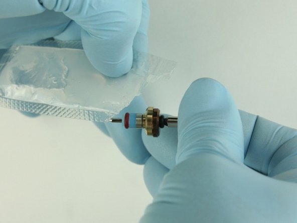 Apply high-pressure lubricant to the outside diameter of the high-pressure valve seal.