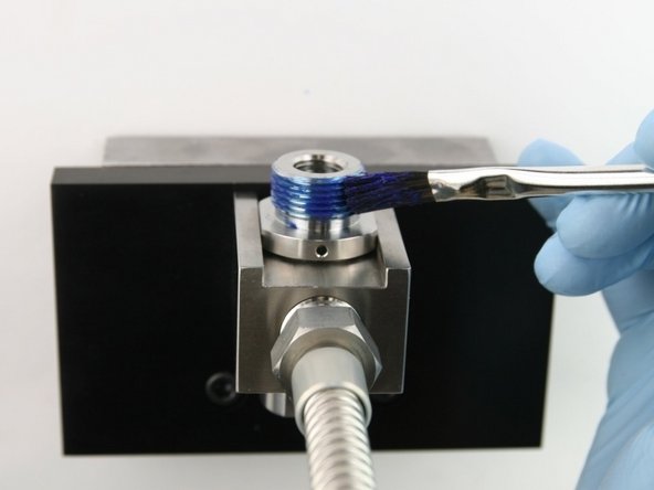 Apply  Blue Goop to the top threads of the valve body.