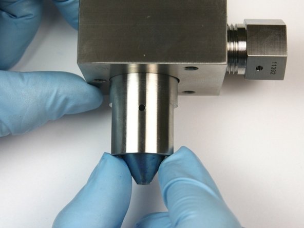 Remove the high-pressure seat from the bleed down valve body.