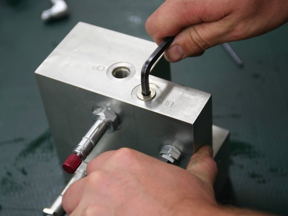 Install plug (6MBP) into port stamped BD on top of new manifold.