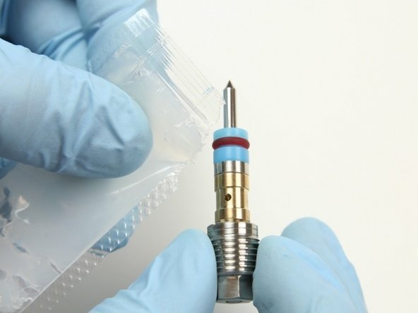 Apply high vacuum grease to exterior of HP seal, hoop, and bushing