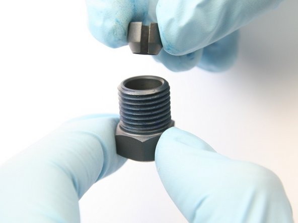 Place the collet with the tapered side down into the high-pressure gland.