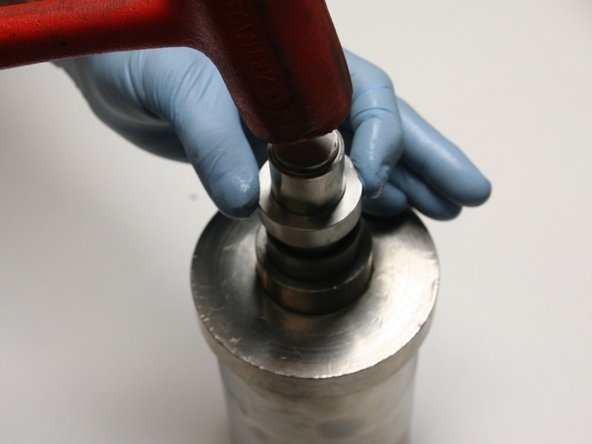 Secure the hoop in place by tapping the installation tool with a rubber mallet until the tool bottoms out on the guide.