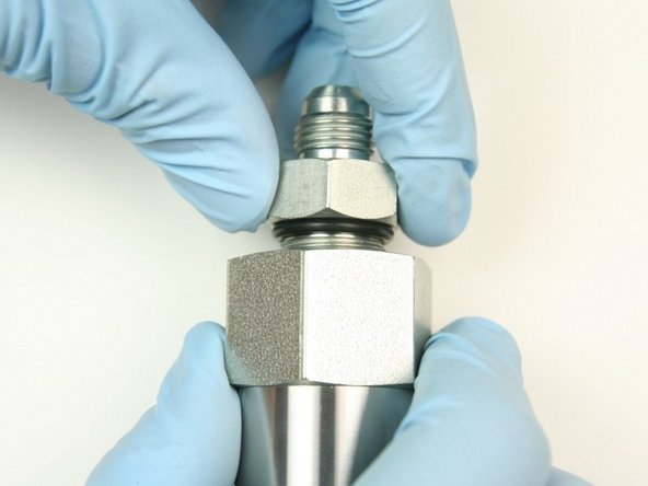 Thread the hydraulic adapter into the adapter fitting.