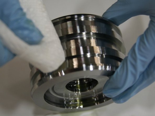 Wipe down the piston with the towel to remove excess hydraulic fluid.