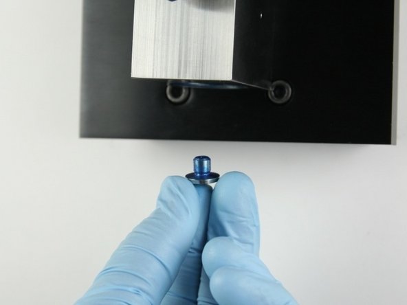 Put the seat into the bottom of the valve body.