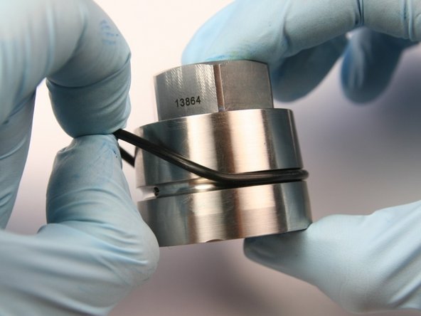 Remove the O-ring from the outside groove of the bearing half of the swivel housing.