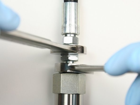 Tighten the hydraulic hose to the hydraulic fitting using 7/8&quot; and 3/4&quot; wrench.