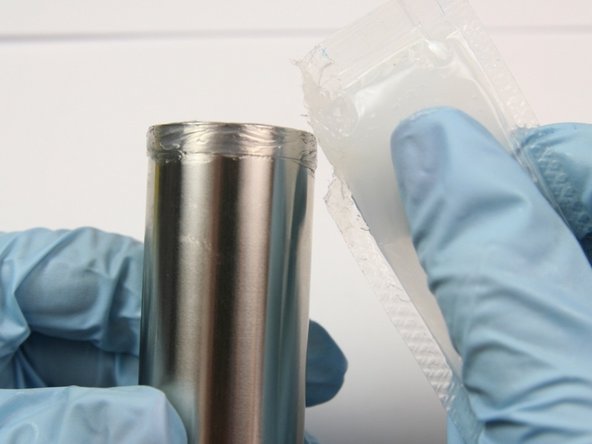 Apply a light coat of grease to both ends of the back-up seal sleeve.