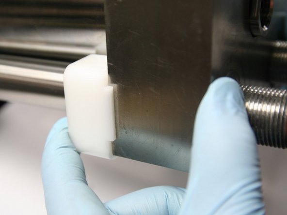 Push HP endcap against HP cylinder and align tabs of mounting cradle so cradle supports HP endcap