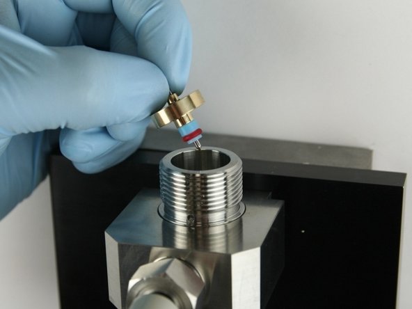 Put the needle point at the top of the valve body.