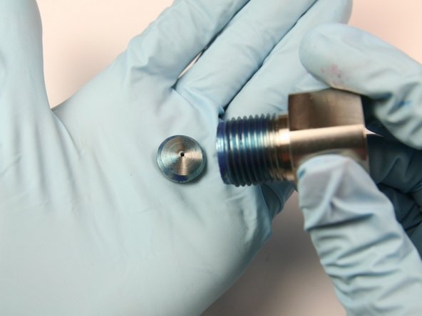 Remove the high-pressure seat from the bleed down valve body and discard.