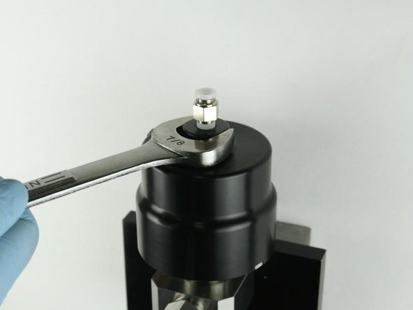 Tighten the actuator to the valve body using a 7/8&quot; wrench.