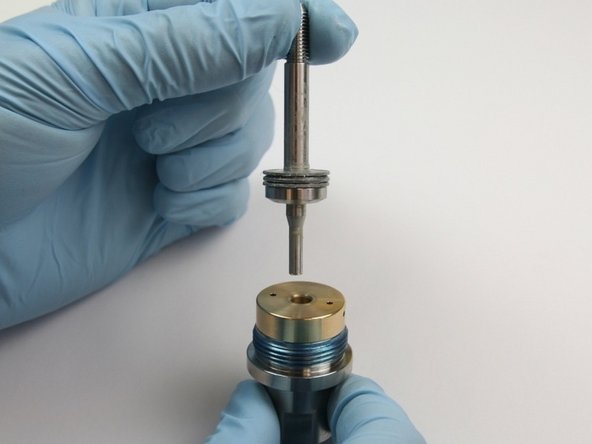 Put the short end of the swivel shaft into the back-up bearing until it bottoms out.