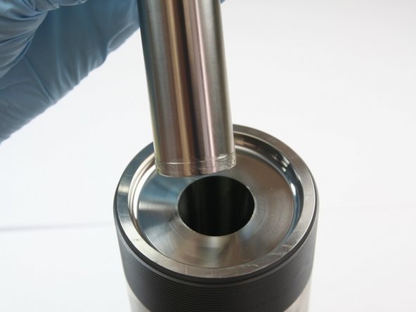 Put the sleeve into the open end of the high-pressure cylinder and repeat the high-pressure seal installation process.
