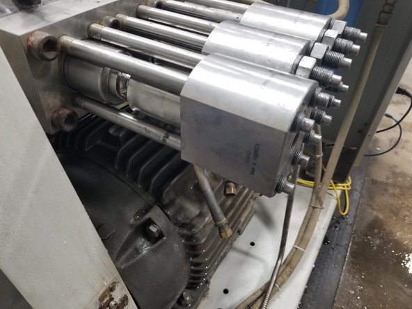 Remove the fours nuts and washers