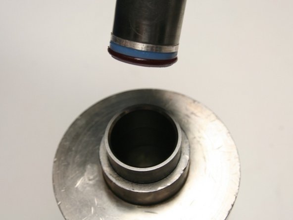 Put the installation tool with the hoop and seal into the sleeve.