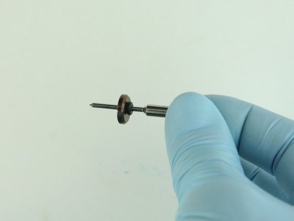 Slide the stainless steel back-up ring on to the valve stem point with the chamfer side towards the O-ring.