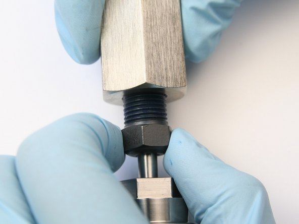 Thread the high-pressure gland into the coupler.