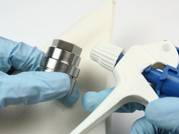 Clean the bearing half of the swivel housing with isopropyl alcohol or a  similar cleaning agent.