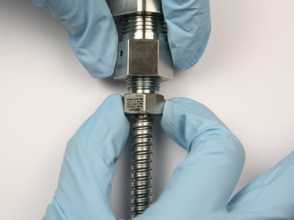 Thread in gland nut with HP tubing into bleed down valve adapter