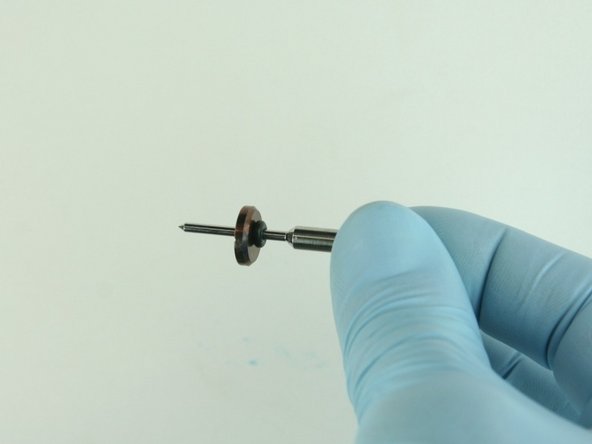 Slide the stainleass steel back-up ring on to the valve stem point with the chamfer side towards the O-ring.