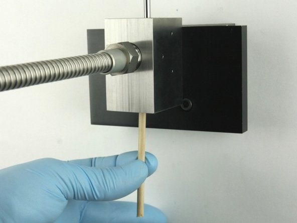 Remove all the valve components from the valve body with the included dowel.