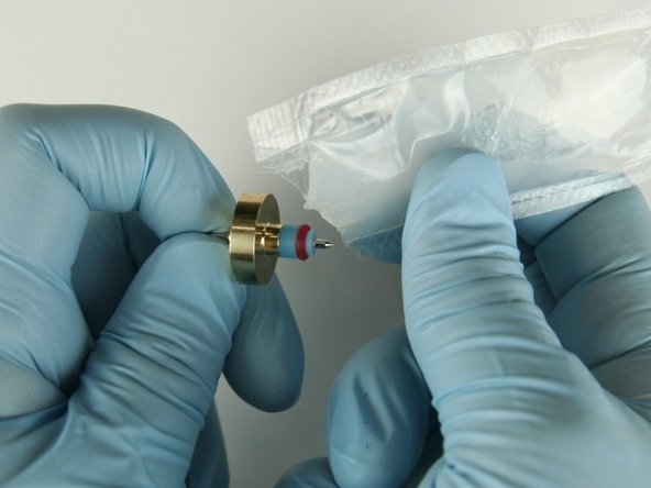 Apply a high-pressure lubricant to the  outside diameter of the high-pressure valve seal.