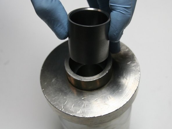 Put the installation sleeve into the sleeve guide with the larger ID, with the tapered end, up.