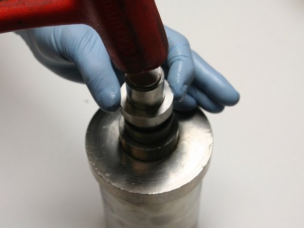 Secure the hoop in place by tapping the installation tool with a rubber mallet until the tool bottoms out on the guide.