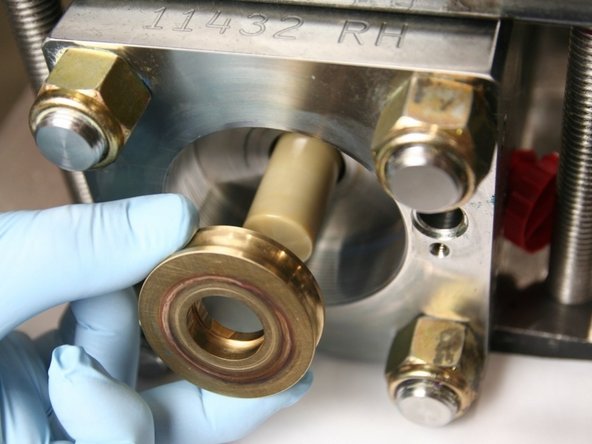 Remove the old bronze back-up ring from the plunger.