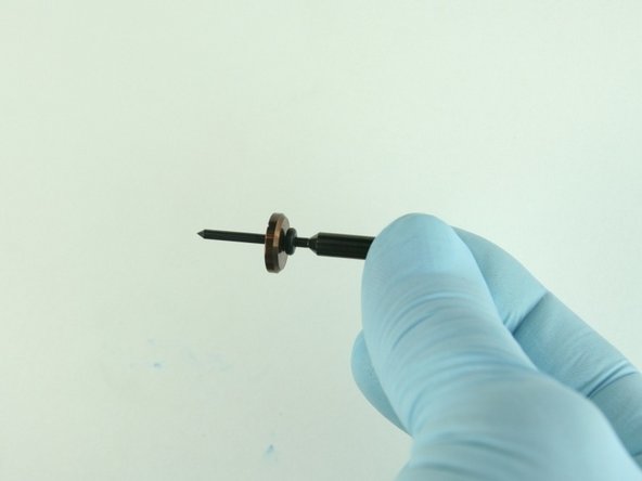 Slide the stainless steel back-up ring on to the valve stem point with the chamfer side towards the O-ring.