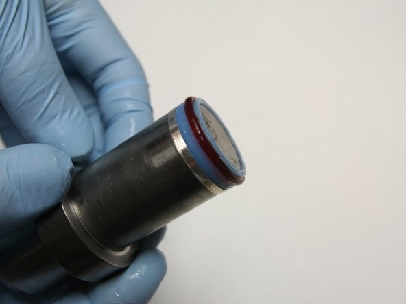 Put the seal and hoop onto the bigger stepped side of the installation tool.