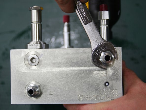 Install large 24VDC coil (removed from old manifold) onto large solenoid stem  of control manifold.