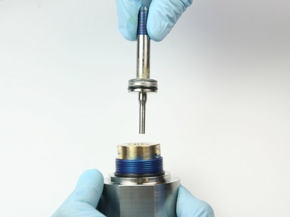 Put the short end of the swivel shaft into the back-up bearing.