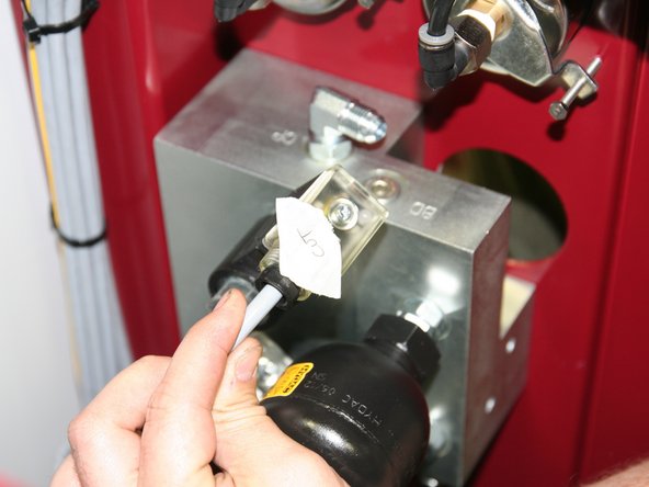 Tighten DIN connectors to coils.