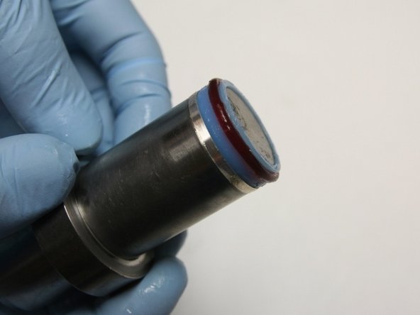 Put the seal and the hoop onto the bigger stepped side of the installation tool.