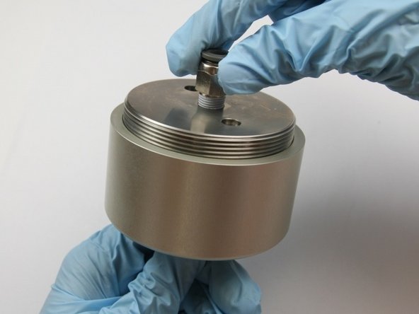 Thread the actuator cap into the actuator housing.