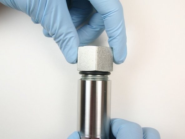 Thread the adapter fitting into the actuator housing.