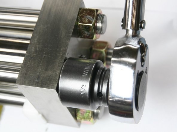 Torque nuts using a cross pattern according to the following directions