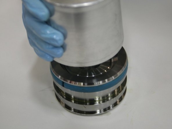 To create the modified wear ring, shave one edge of a new wear ring (not included in kit) with a belt sander and have the wear ring facing up so there is an easier placement of the cap seal.