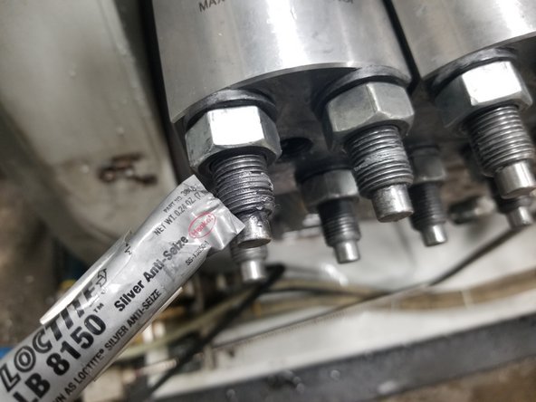 Wipe stud threads clean and apply Loctite 8150 anti-seize (#1-18750)