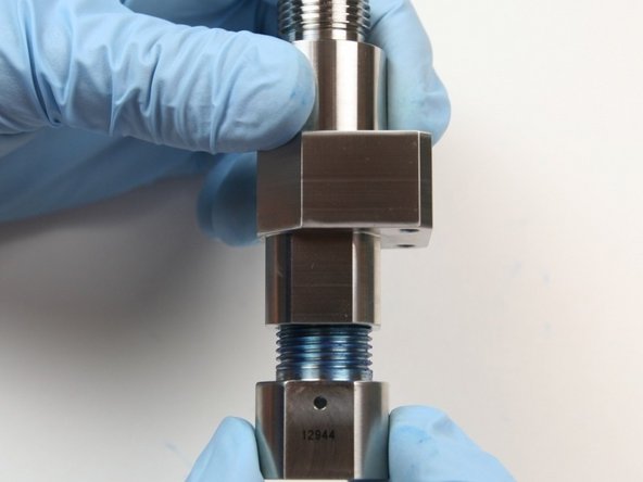 Thread the outlet adapter into the valve body.