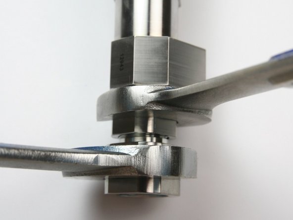 Loosen the outlet fitting from the bleed down valve body using 7/8&quot; and 13/16&quot; wrench.