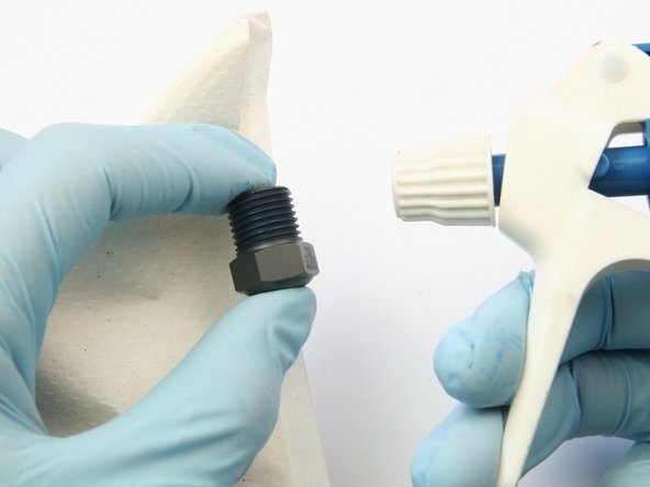 Clean the high-pressure gland of all Blue Goop with isopropyl alcohol.