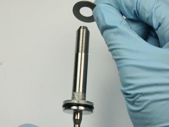 Slide the first thrust washer onto the swivel shaft.