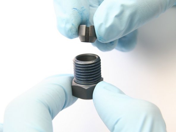 Put the collet with the tapered side down into the high-pressure gland nut.