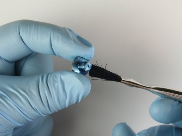 Apply Blue Goop to all surfaces of the seat.