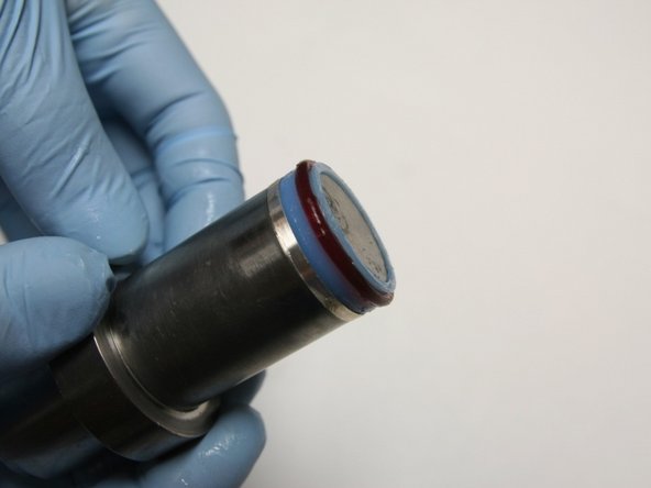 Put the seal and hoop onto the bigger stepped side of the installation tool.