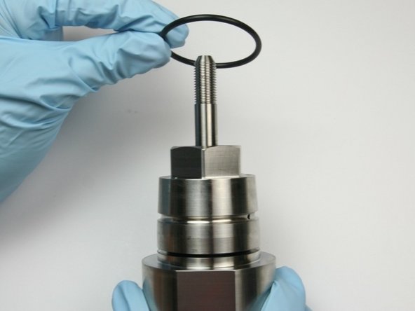 Roll the dust protecting O-ring over the bearing half of the assembly.